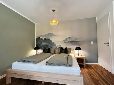 Ein Bett oder Betten in einem Zimmer der Unterkunft Ammersee Apartment Schondorf