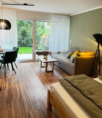 Ein Bett oder Betten in einem Zimmer der Unterkunft Ammersee Apartment Schondorf