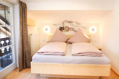 Ein Bett oder Betten in einem Zimmer der Unterkunft Ferienwohnung BERGerholen