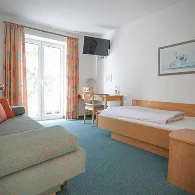Ein Bett oder Betten in einem Zimmer der Unterkunft Hotel Egger-Stüberl