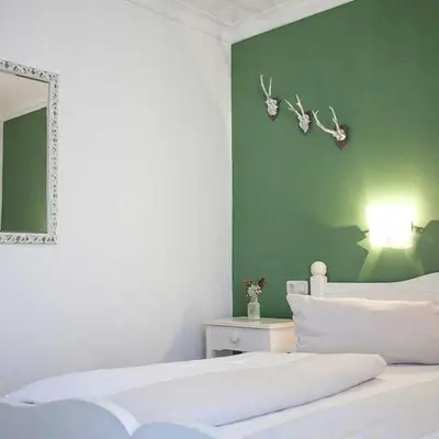 Ein Bett oder Betten in einem Zimmer der Unterkunft Hotel Egger-Stüberl