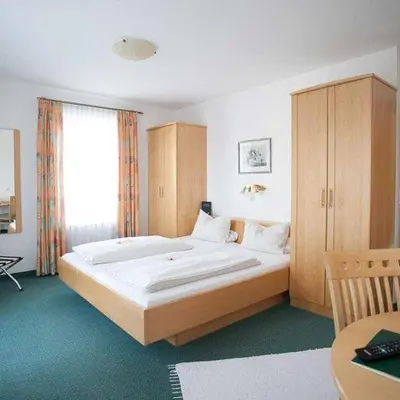 Ein Bett oder Betten in einem Zimmer der Unterkunft Hotel Egger-Stüberl