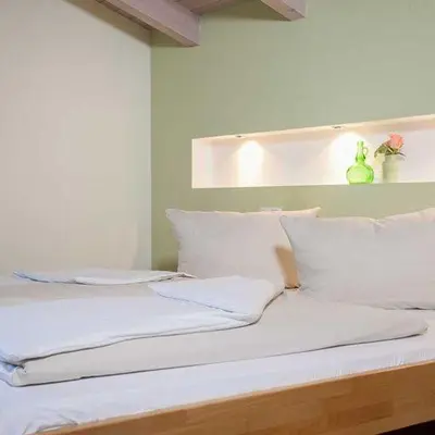 Ein Bett oder Betten in einem Zimmer der Unterkunft Hotel Egger-Stüberl