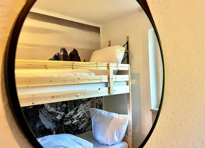 Ein Bett oder Betten in einem Zimmer der Unterkunft Maisonettewohnung Steinbock mit Bergblick