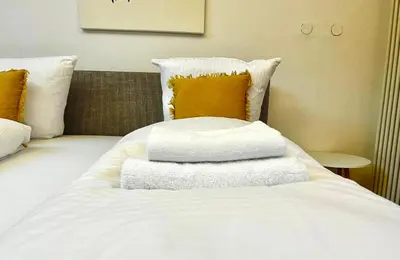 Ein Bett oder Betten in einem Zimmer der Unterkunft Maisonettewohnung Steinbock mit Bergblick