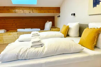 Ein Bett oder Betten in einem Zimmer der Unterkunft Maisonettewohnung Steinbock mit Bergblick