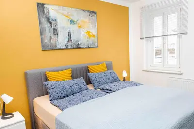 Ein Bett oder Betten in einem Zimmer der Unterkunft nice2be Apartments