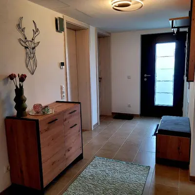 Ein Bett oder Betten in einem Zimmer der Unterkunft Ferienwohnung Am Hochfeld