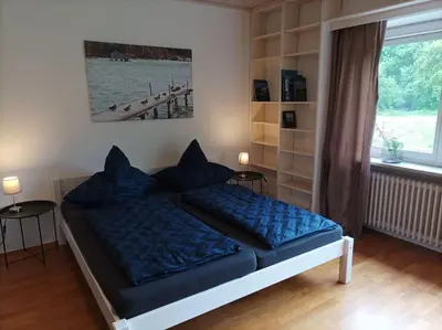 Ein Bett oder Betten in einem Zimmer der Unterkunft Ferienhaus am Ammersee in Bierdorf