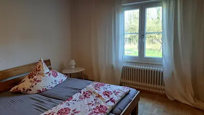 Ein Bett oder Betten in einem Zimmer der Unterkunft Ferienhaus am Ammersee in Bierdorf