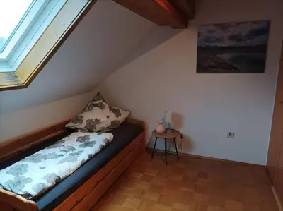 Ein Bett oder Betten in einem Zimmer der Unterkunft Ferienhaus am Ammersee in Bierdorf