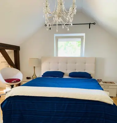 Ein Bett oder Betten in einem Zimmer der Unterkunft Apartment amidst nature-Riverdale, north of Munich
