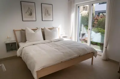 Ein Bett oder Betten in einem Zimmer der Unterkunft Design Apartment Alpenvorstadt