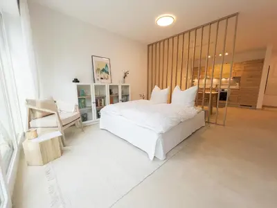 Ein Bett oder Betten in einem Zimmer der Unterkunft Design Apartment Alpenvorstadt